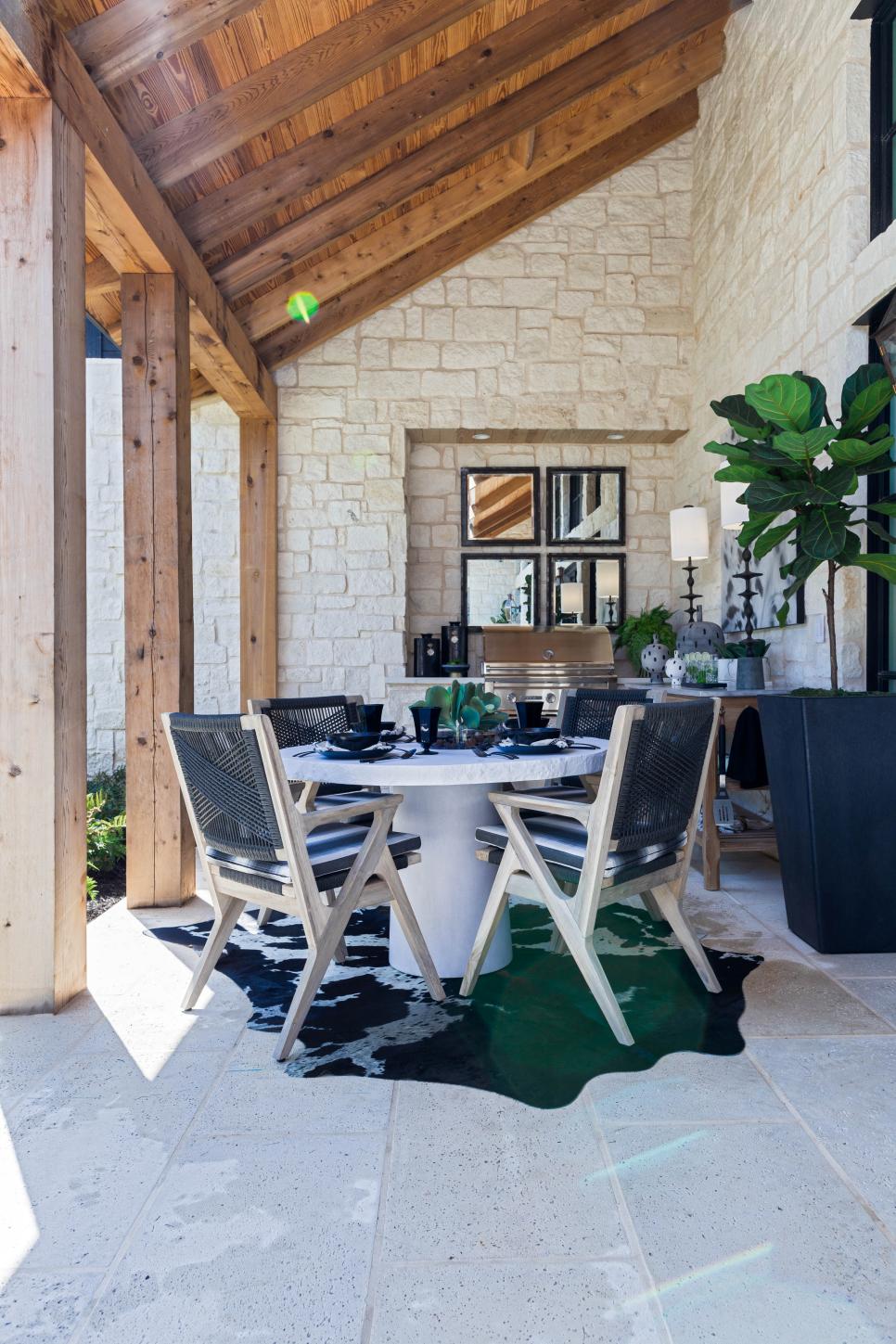 Contemporary Black and White Outdoor Dining Room With Pedestal Table HGTV